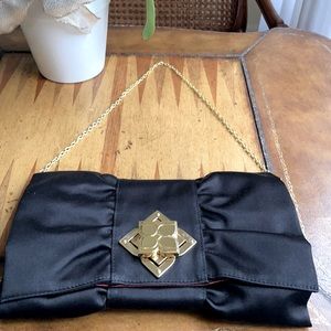 BCBG satin black bow clutch